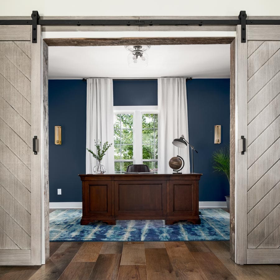 Office design with blue wall accent and barn doors in Nashville, Tennessee